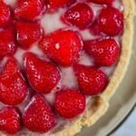 Very Easy Romanian Strawberry Tart Recipe – Tarta cu Capsuni A close-up of the tart, with the strawberries covered in jelly shining