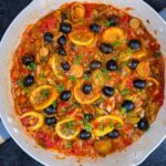 Romanian Leek Stew With Olives Recipe – Mancare de Praz cu Masline A large pan with the stew in it photographed from above