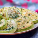 Romanian Grilled Zucchini Salad Recipe – Salata de Dovlecei la Gratar The grilled slices of zucchini arranged on a round platter