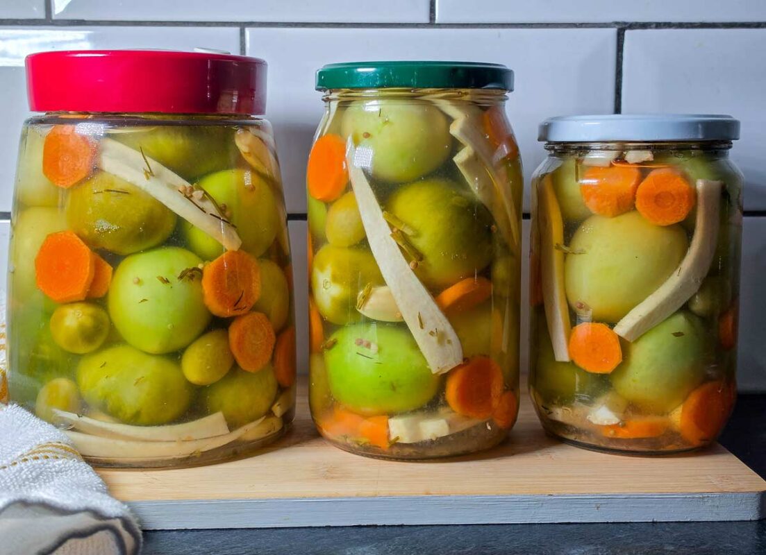 Pickled green tomatoes in jars